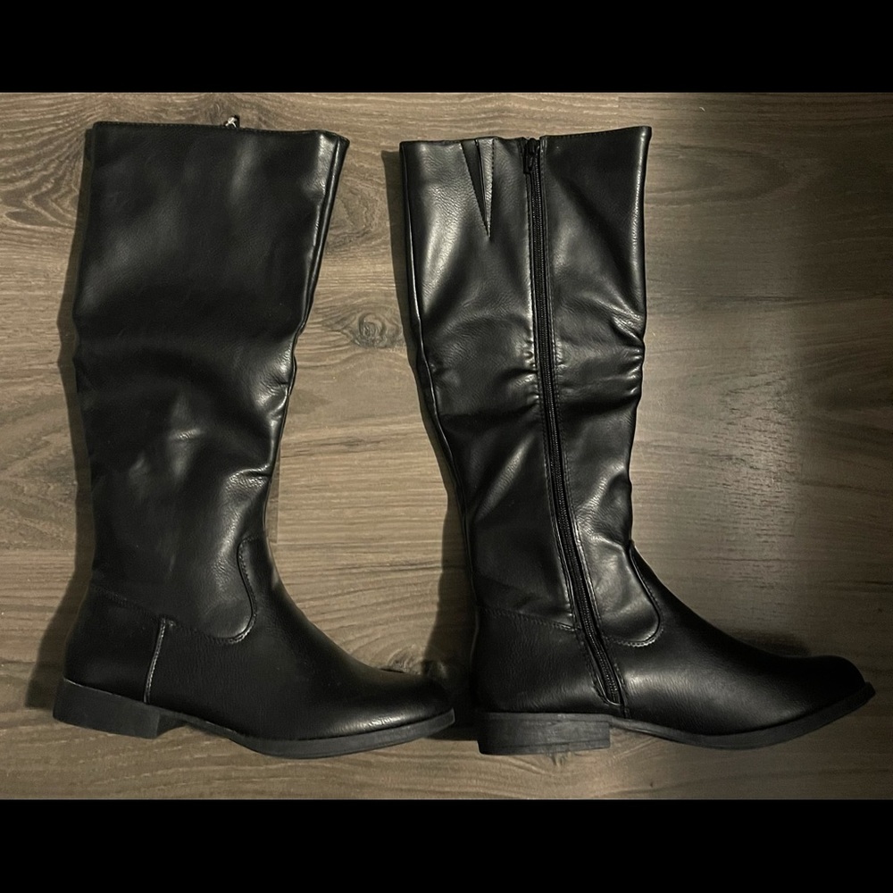 WB faux black leather boots.